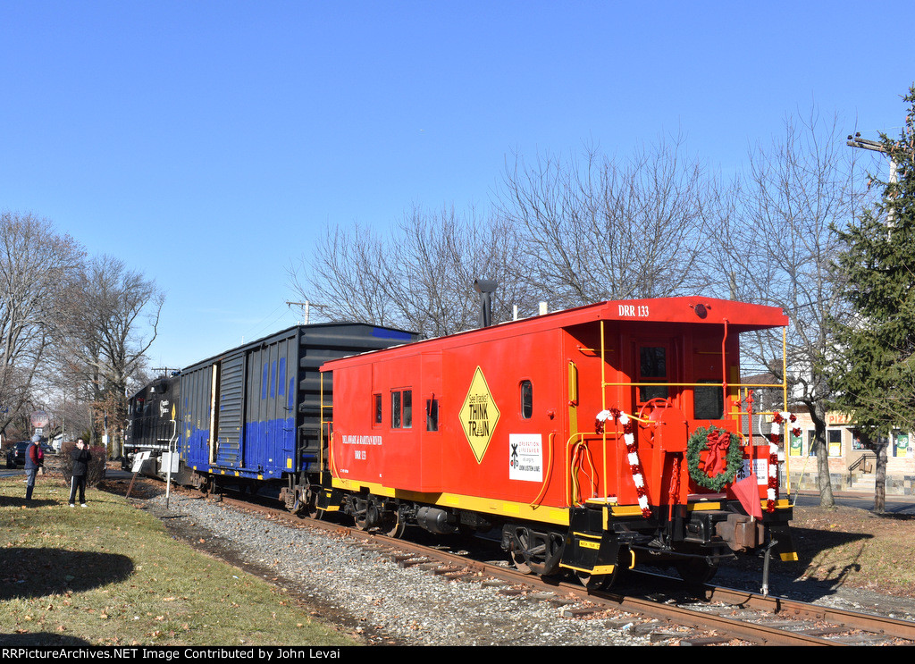 Delaware & Raritan River caboose # 133 trailing just as the train crosses Monmouth Avenue 